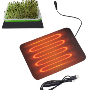 USB-warmtemat met gloeisporen en microgreens-bakje; kabel en in-line schakelaar zichtbaar.